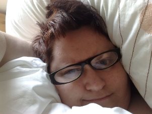 This is an old pic of me & I'm only smiling because I had not intentions of leaving my bed that day :)